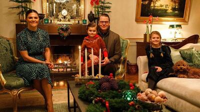 Crown Princess Victoria and Prince Daniel of Sweden, along with their children, Estelle and Oscar, chose this image of the family lighting the first candle of the traditional Advent wreath for their Christmas card. Instagram