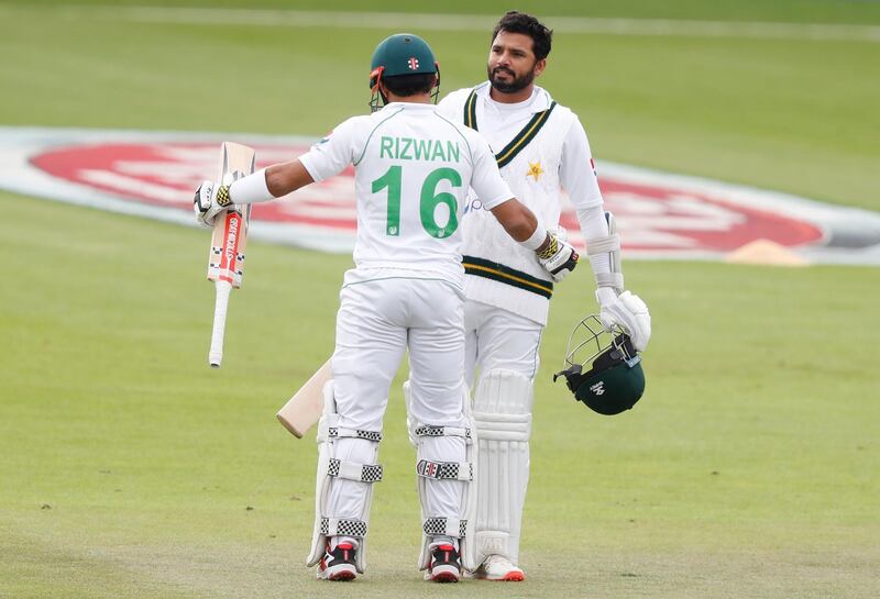 Pakistan's captain Azhar Ali, right, celebrates with batting partner Mohammad Rizwan after scoring a century in Southampton. AP