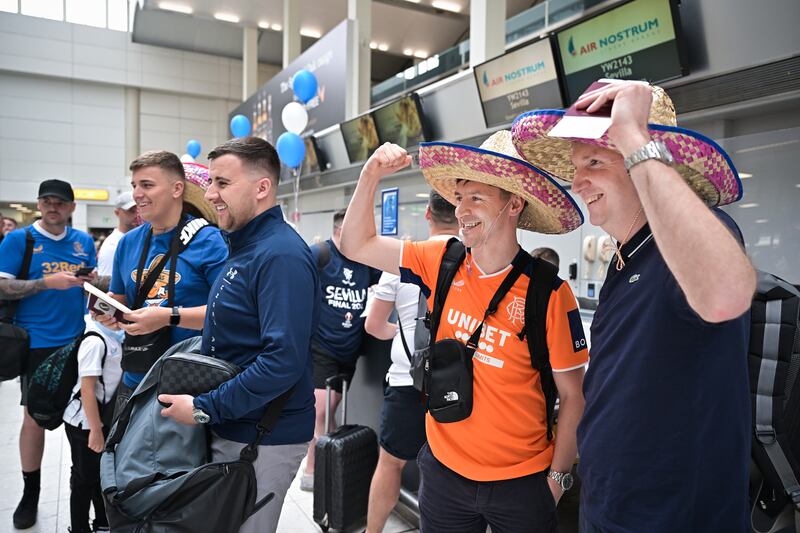 Rangers fans at Glasgow airport as they leave for Seville. Getty