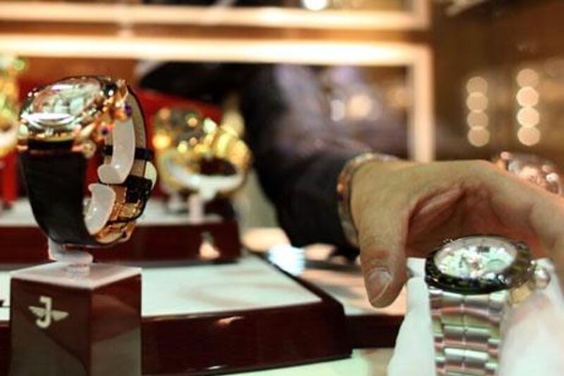 October 14, 2009 / Abu Dhabi / Mohammad Tabaa with Jovial Watches arranges watches in a case at the International Jewelry and Watch Show in Abu Dhabi October 14, 2009.  (Sammy Dallal / The National)



