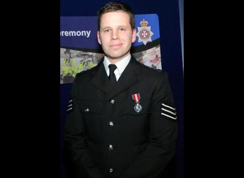 This undated handout photo provided by Wiltshire Police on Thursday, March 8, 2018 shows Detective Sergeant Nick Bailey. Whoever attacked  Sergei Skripal, a former Russian spy, with a rare nerve agent is guilty of a "brazen and reckless act," and Britain will respond without hesitation when it becomes clear who is responsible, the country's security minister said Thursday. Skripal and his daughter are in critical but stable condition at a hospital in Salisbury. A police officer who came to their aid is in a serious condition, though he is conscious and talking, Rudd said. He was identified Thursday as Sgt. Nick Bailey. (Wiltshire Police via AP)