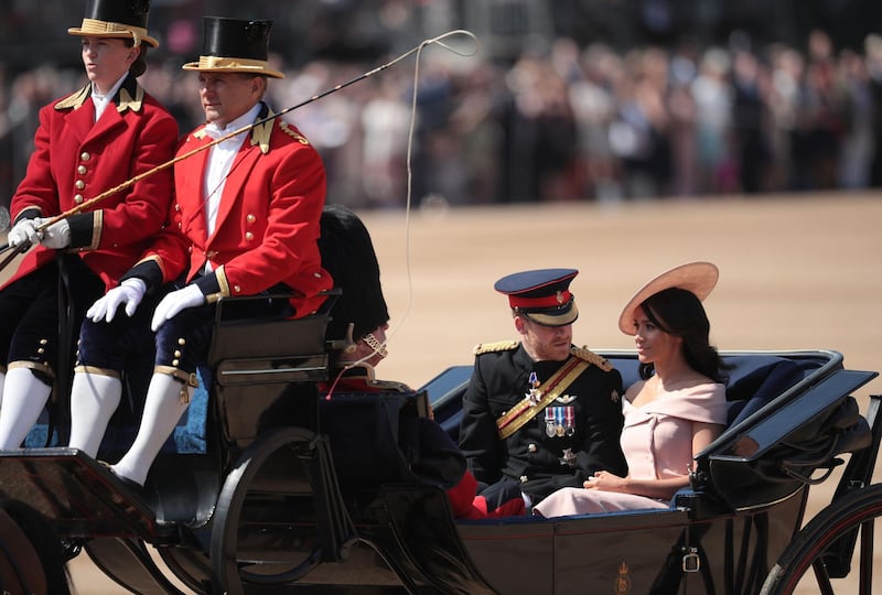 Prince Harry, Duke of Sussex and Meghan, Duchess of Sussex arrive at The Royal Horseguards during Trooping The Colour ceremony in London, England. The annual ceremony involving over 1400 guardsmen and cavalry, is believed to have first been performed during the reign of King Charles II. The parade marks the official birthday of the Sovereign, even though the Queen's actual birthday is on April 21st.  Photo by Dan Kitwood / Getty Images