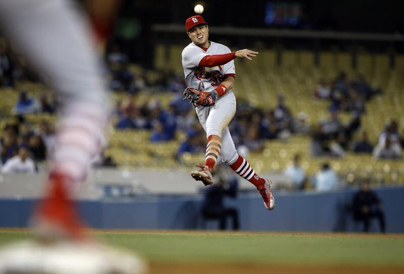 St. Louis Cardinals shortstop Aledmys Diaz throws the ball to get out Los Angeles Dodgers’ Austin Barnes. Alex Gallardo / AP Photo