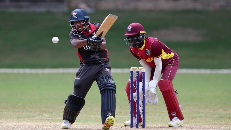 UAE batsman Aayan Khan plays a shot as Rivaldo Clarke of West Indies keeps during the ICC U19 Men's Cricket World Cup Plate semi-final 1 at Queen's Park Oval on January 28, 2022. Photo: ICC