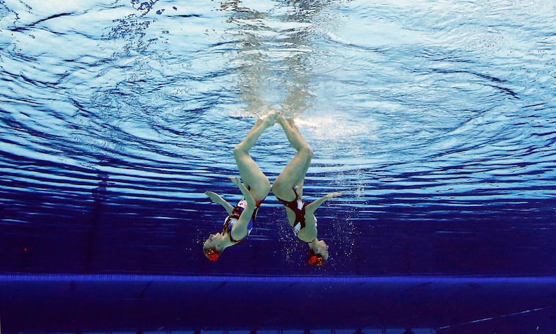 Natalia Ischenko and Svetlana Romanshina of Russia compete during women's duet synchronized swimming preliminary round at the Aquatics Centre in the Olympic Park during the 2012 Summer Olympics in London, Monday, Aug. 6, 2012. (AP Photo/Mark J. Terrill) *** Local Caption ***  APTOPIX London Olympics Synchronized Swimming.JPEG-0996b.jpg
