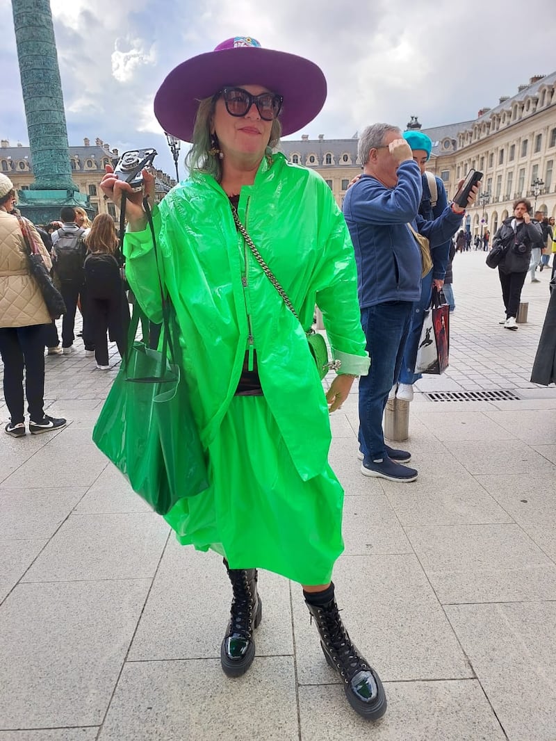 Dressed for the rain in matching bright green ripstop nylon.