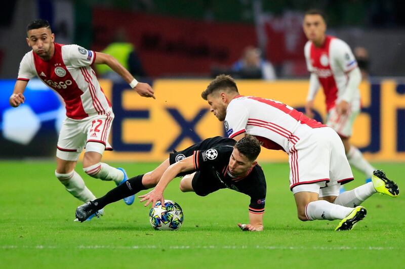 Chelsea midfielder Jorginho is challenged by Ajax players during the Champions League game at the Amsterdam ArenA. AP Photo