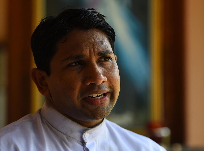 In this picture taken on May 4, 2019, Catholic priest Father Suranga Warnakulasuriya speaks during an interview with AFP in Negombo. Father Suranga Warnakulasuriya said prayers alone in his church Sunday, as Catholic services were suspended across Sri Lanka for the second straight week since the Easter suicide attacks.
 / AFP / ISHARA S. KODIKARA
