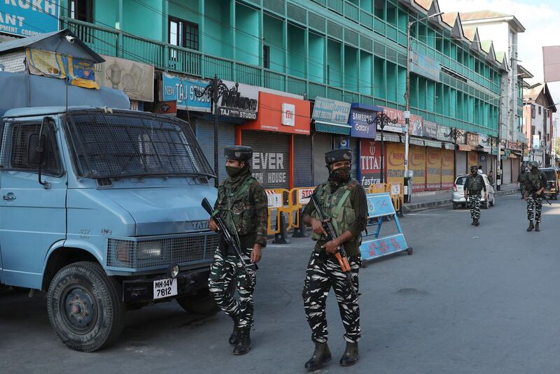 Indian paramilitary soldiers patrol near a closed market in Srinagar, the summer capital of Indian-controlled Kashmir, after the death of Syed Ali Geelani. EPA