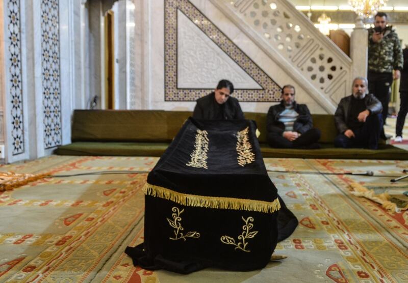 Mourners surround the casket of film director Hatem Ali inside al-Hussein mosque in the Syrian capital Damascus, before his funeral. AFP