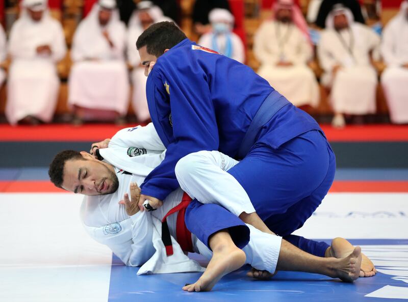 Faisal Al Ketbi, in white, leads the UAE men's jiu-jitsu team. Chris Whiteoak / The National