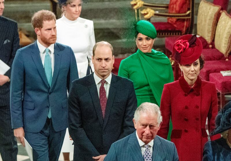 Prince Harry and Meghan walk behind Prince William and Kate, with King Charles at Westminster Abbey in London. AP