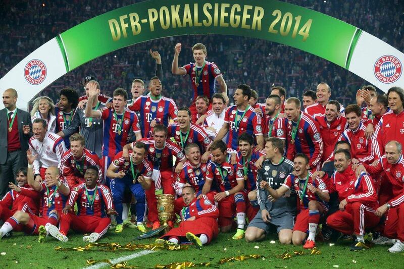 Bayern Munich players celebrate after they beat Borussia Dortmund in the German Cup final on Saturday. Kay Nietfeld / EPA / May 17, 2014