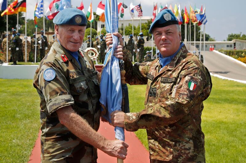 Former Head of Mission and Force Commander of the United Nations Interim Force in Lebanon (UNIFL) , Maj Gen Michael Beary of Ireland hands over the UN flag to his newly-appointed replacement Maj Gen Stefano Del Col from Italy. AP