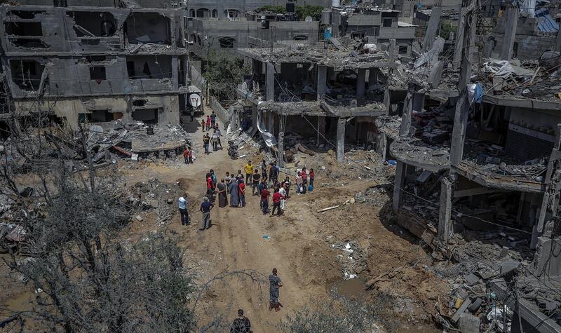 Palestinians inspect the rubble of their destroyed houses after a ceasefire between Israel and Gaza fighters, in Beit Hanoun, northern Gaza Strip. EPA