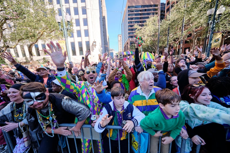 The crowd cheers as members of the Zulu Social Aid & Pleasure Club Parade pass by during Mardi Gras celebrations. EPA