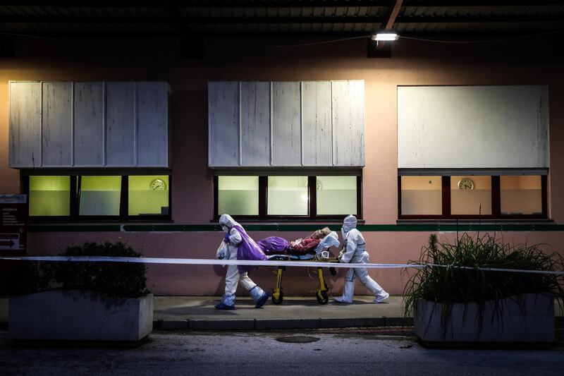 Paramedics transport COVID-19 patients from Amadora Sintra Hospital to Luz Hospital in Lisbon, in Amadora, Portugal, due to the rising of hospitalizations. The Amadora-Sintra Hospital moved a team of doctors, nurses and auxiliaries to accompany the 19 patients who are being transferred to the infirmary that will open at Hospital da Luz in Lisbon.  EPA