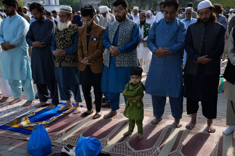 Muslims perform prayers on the first day of Eid Al Fitr in Rawalpindi, Pakistan. AP