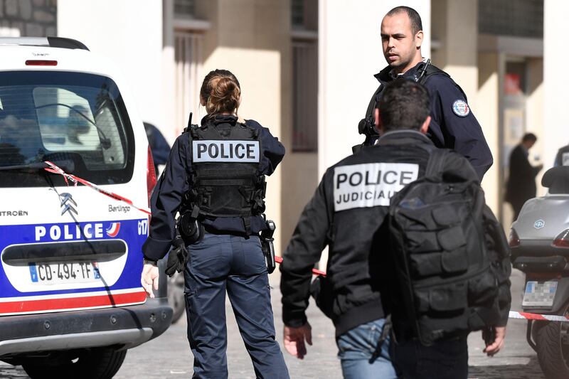 Police work at the site where a car slammed into soldiers on patrol in in the northwestern suburb of Levallois-Perret. Stephane De Sakutin.