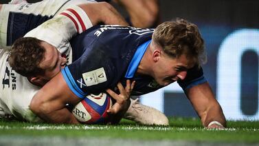 Scotland wing Duhan van der Merwe dives across the line to score a try during the Six Nations match against England at Twickenham on February 4, 2023. AFP