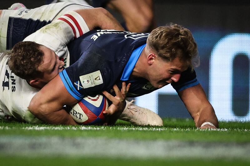 Scotland wing Duhan van der Merwe dives across the line to score a try during the Six Nations match against England at Twickenham on February 4, 2023. AFP