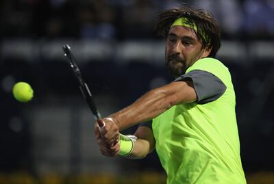 DUBAI, UNITED ARAB EMIRATES - FEBRUARY 26:  Marcos Baghdatis of Cyprus in action against Victor Troicki of Serbia during day one of the ATP Dubai Duty Free Tennis Championships at the Dubai Duty Free Stadium on February 26, 2018 in Dubai, United Arab Emirates.  (Photo by Francois Nel/Getty Images)