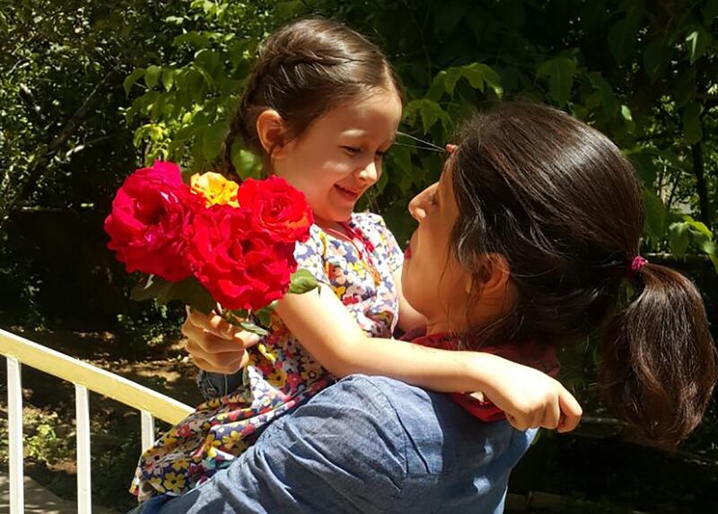 A handout picture released by the Free Nazanin campaign on August 23, 2018 shows Nazanin Zaghari-Ratcliffe (R) embracing her daughter Gabriella in Damavand, Iran following her release from prison for three days. - Nazanin Zaghari-Ratcliffe, a British-Iranian woman who has been in prison in Tehran for more than two years on sedition charges, has been released for three days, her husband said today. (Photo by - / Free Nazanin campaign / AFP) / RESTRICTED TO EDITORIAL USE - MANDATORY CREDIT "AFP PHOTO / FREE NAZANIN CAMPAIGN" - NO MARKETING NO ADVERTISING CAMPAIGNS - DISTRIBUTED AS A SERVICE TO CLIENTS - NO ARCHIVE