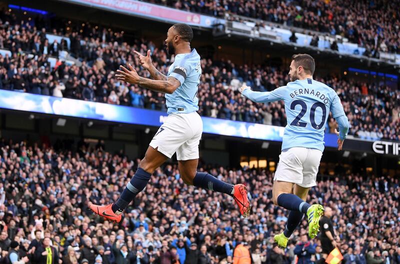 Sterling, left, and Silva celebrate. Getty