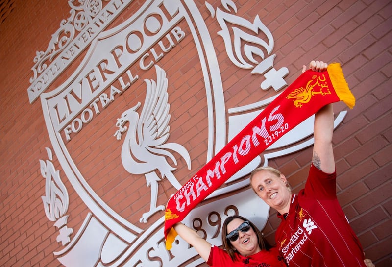 Liverpool fans celebrating outside Anfield stadium. EPA