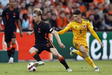 Frenkie de Jong (L) of Netherlands and Harry Wilson of Wales in action during the UEFA Nations League soccer match between Netherlands and Wales in Rotterdam, Netherlands, 14 June 2022.   EPA / MAURICE VAN STEEN