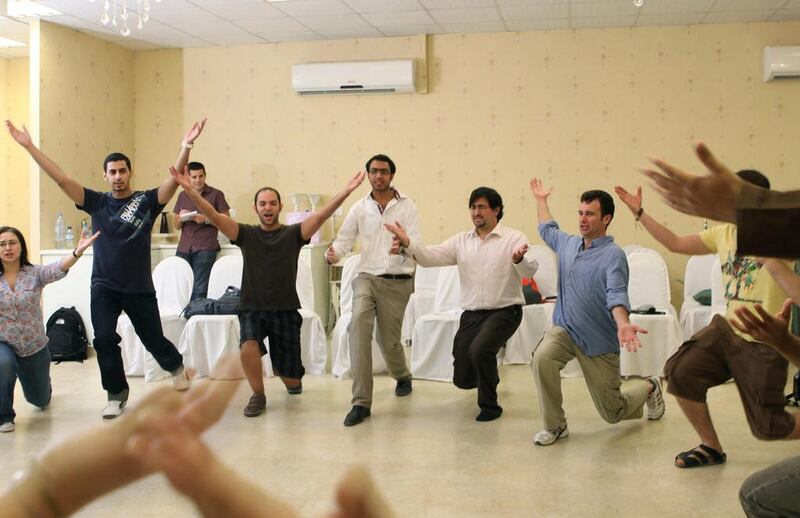 Participants warming up ahead of a comedy workshop led by Dean Obeidallah, an American comedian, organised by the Dubomedy Arts School. Randi Sokoloff for The National