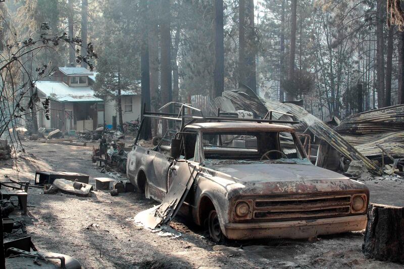 An out building and pickup truck damaged by the Rim Fire is seen in this undated United States Forest Service handout photo near Yosemite National Park, California,  released to Reuters August 27, 2013. The Rim Fire, one of the largest wildfires in California history, roared deeper into Yosemite National Park early on Tuesday while flames on the opposite side of the sprawling blaze crept closer toward thousands of homes outside the park, fire officials said.  REUTERS/Mike McMillan/U.S. Forest Service/Handout via Reuters  (UNITED STATES - Tags: DISASTER) FOR EDITORIAL USE ONLY. NOT FOR SALE FOR MARKETING OR ADVERTISING CAMPAIGNS. THIS IMAGE HAS BEEN SUPPLIED BY A THIRD PARTY. IT IS DISTRIBUTED, EXACTLY AS RECEIVED BY REUTERS, AS A SERVICE TO CLIENTS *** Local Caption ***  LOA103_USA-FIRE-YOS_0828_11.JPG