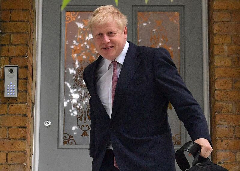 Conservative MP Boris Johnson leaves a house in London on June 7, 2019.  Boris Johnson, considered the frontrunner to become Britain's next prime minister, is Friday challenging a private prosecution bid accusing him of misconduct in public office over the claim that Britain sends £350 million ($440 million, 400 million euros) a week to the European Union. / AFP / Daniel LEAL-OLIVAS
