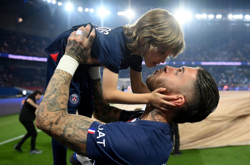 Sergio Ramos with one of his children. Reuters