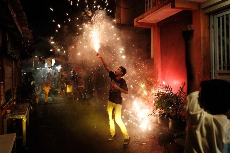 A young Muslim man sets off fireworks on the eve of Eid Al Fitr in Jakarta, Indonesia. AFP