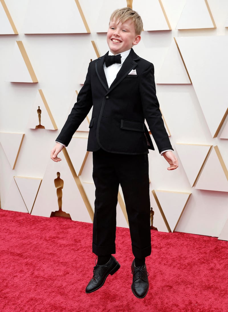 'Belfast' star Jude Hill wears a Thom Browne tuxedo. Reuters