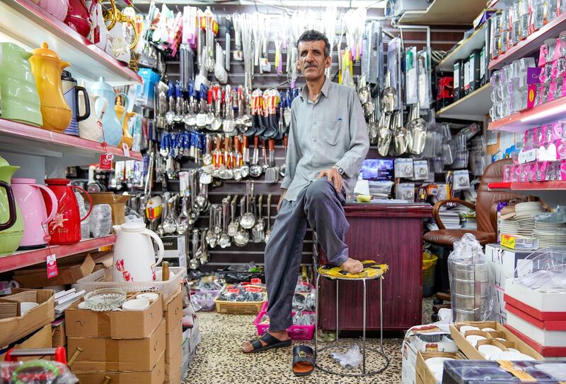 Abu Dhabi, United Arab Emirates, July 17, 2019.  Vendors of Al Mina Photo Project. --
Veteran vendor of the Al Mina Souk, Ibrahim Abdul Kareem- 65, has been working at the Al Mina appliance and kitchenware area for 26 years now.  He is from Iran.
Victor Besa/The National
Section:  NA
Reporter: