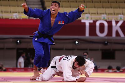Mongolia's Saeid Mollaei reacts after defeating Georgia's Tato Grigalashvili in the judo men's -81kg quarterfinal bout during the Tokyo 2020 Olympic Games at the Nippon Budokan in Tokyo on July 27, 2021. AFP