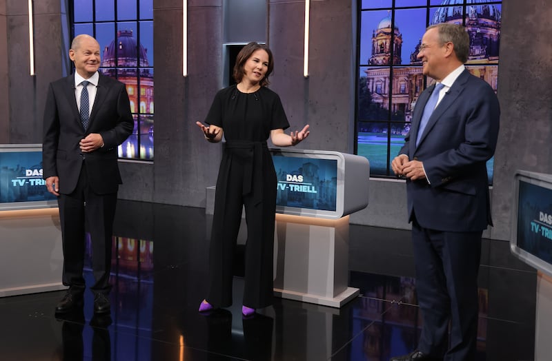 Candidates to become the next leader of Germany -- Olaf Scholz (left), Annalena Baerbock and Armin Laschet -- take part in a final televised debate in Berlin before Sunday's elections. Photo: Getty