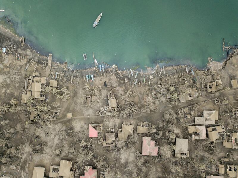 An aerial view shows buildings covered in ash in the village of Buso Buso. AFP