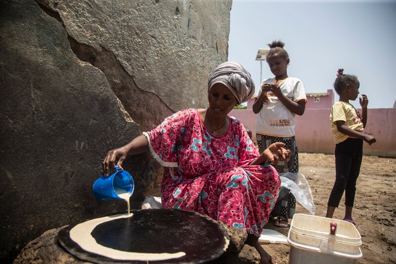 Alem Ande, from Eritrea, bakes bread to sell in the camp. She divorced her violent husband and was living in Hitsats camp in Tigray with her five children until war broke out in November 2020, when they fled to Sudan. Getty