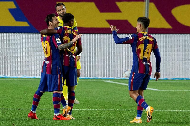 Lionel Messi, Ansu Fati and midfielder Philippe Coutinho celebrate the fourth goal. EPA
