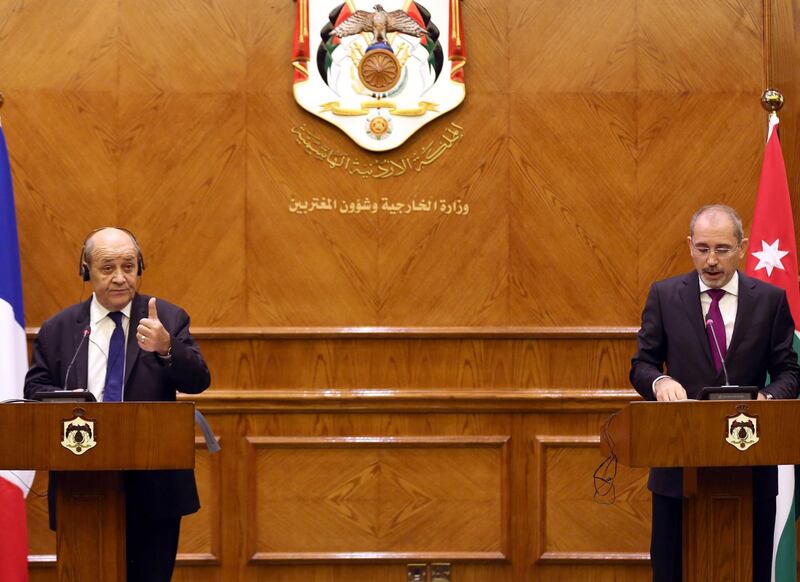 French Foreign Affairs Minister Jean-Yves Le Drianand Jordanian Foreign Minister Ayman Safadi hold a joint press conference at the Jordanian Foreign Ministry in Amman. AFP