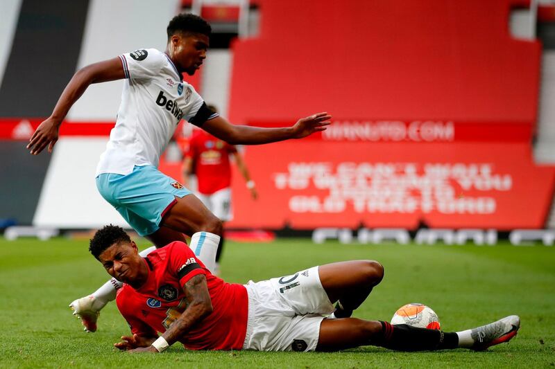 Manchester United's Marcus Rashford goes down under a challenge from West Ham United's Ben Johnson. AFP