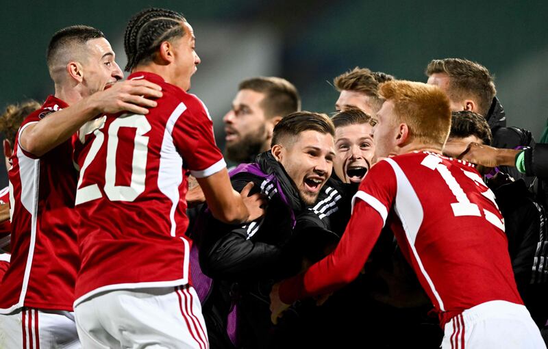 Hungary players celebrate after the draw with Bulgaria sent them through to Euro 20204. AFP