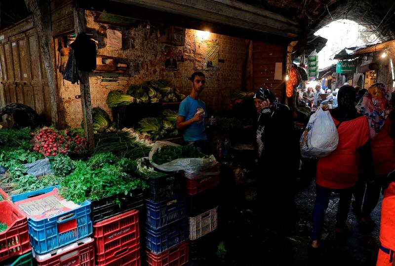 People shop at a vegetable market in Tripoli, Lebanon. AFP