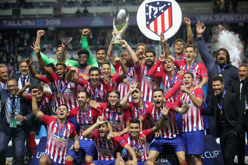 Atletico Madrid celebrate with the trophy following the UEFA Super Cup against Real Madrid in Tallinn, Estonia. Getty
