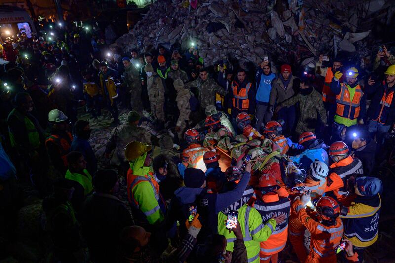 Rescuers stretcher away Ece Koseoglu, 25, after being removed from under the rubble of a collapsed building. AFP