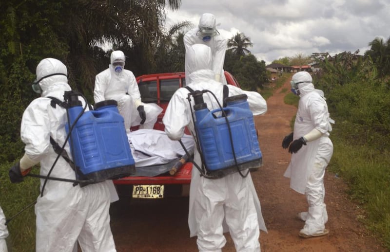Health workers tackle the Ebola outbreak in Liberia in 2014. Simon Bland said Africa's experience in tackling such outbreaks left it relatively well set up to tackle Covid-19. Wade Williams / AP