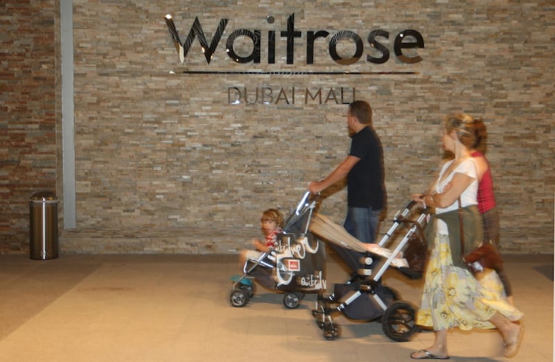 DUBAI, UNITED ARAB EMIRATES - NOVEMBER 8:  People shopping in the recently opened Waitrose supermarket at the Dubai Mall in Dubai on November 8, 2008.  (Randi Sokoloff / The National)  To go with story by James Brennan.